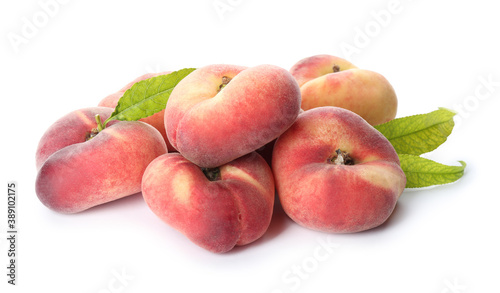 Fresh donut peaches with leaves on white background
