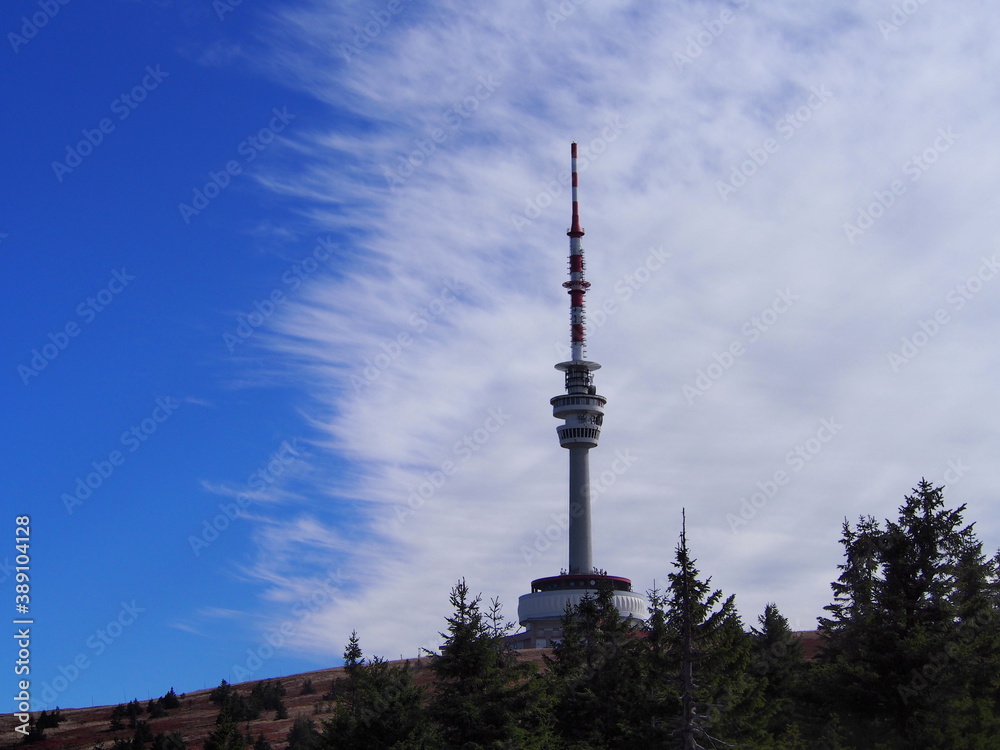 transmitter tower on Praděd with beautiful blue and white sky on an autumn sunny day, Jeseníky Mountains, Czech Republic, travel