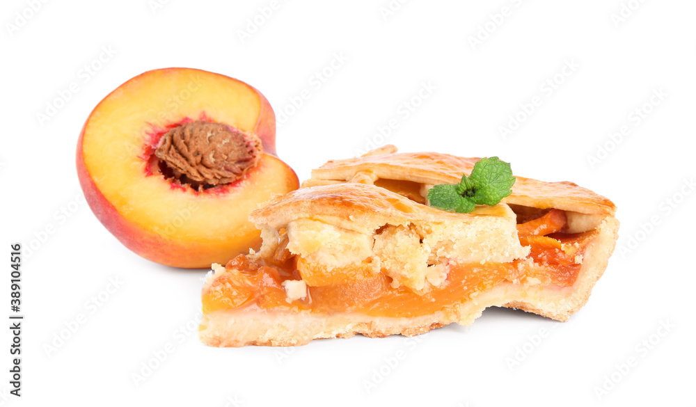 Slice of delicious peach pie and fresh fruit isolated on white