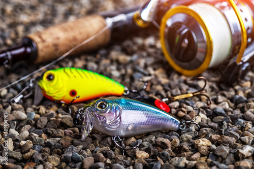 Fishing theme.Fishing tackle - fishing spinning  lures and wobblers.Closeup of a fishing box with colorful lures.