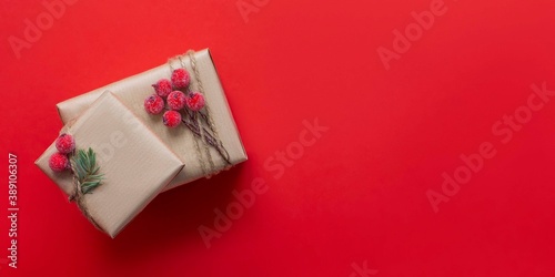 Christmas gift boxes with winter derry on red background . Christmas and New Year banner banner .