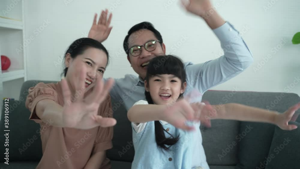happy family at home, Parents and daughters video call with them friends, say hi or goodbye on laptop happy family at home, Parents and daughters video call with them friends, say hi or goodbye on laptop