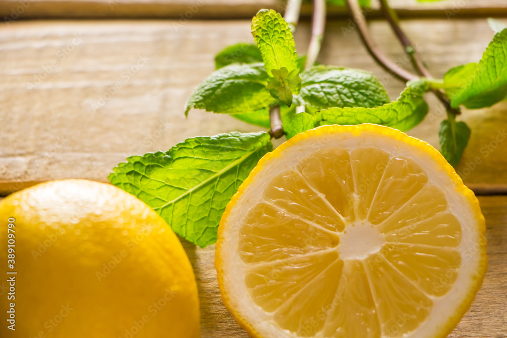 Fresh lemons and peppermint on wooden background. Fresh lemons and peppermint on wooden background.