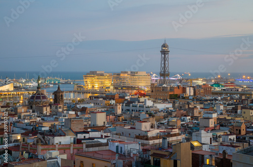 Barcelona - The city centre at dusk - look to the harbor with the cable railway tower.