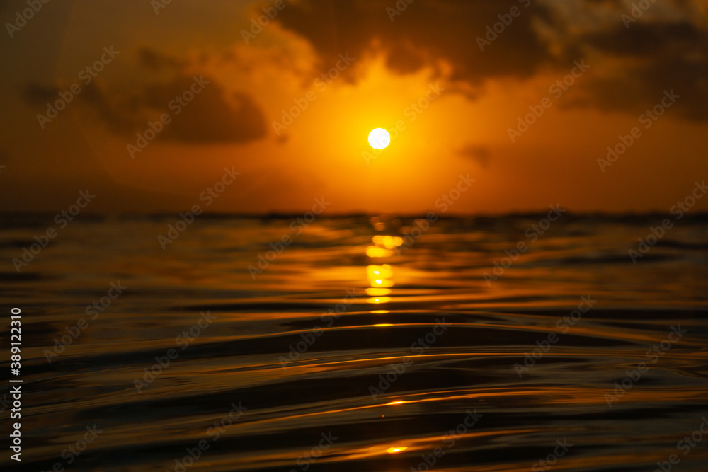 Golden sunset in tropical island Bali from the ocean