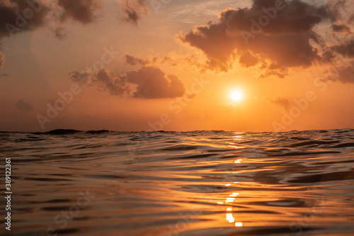 Golden sunset in tropical island Bali from the ocean