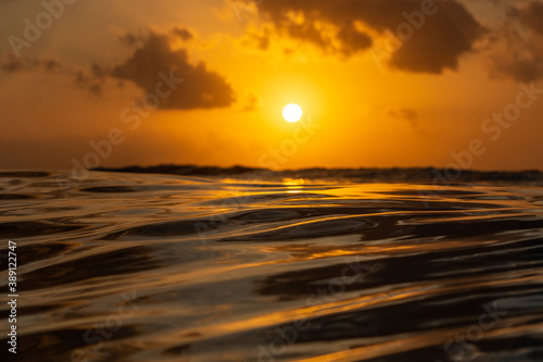 Golden sunset in tropical island Bali from the ocean