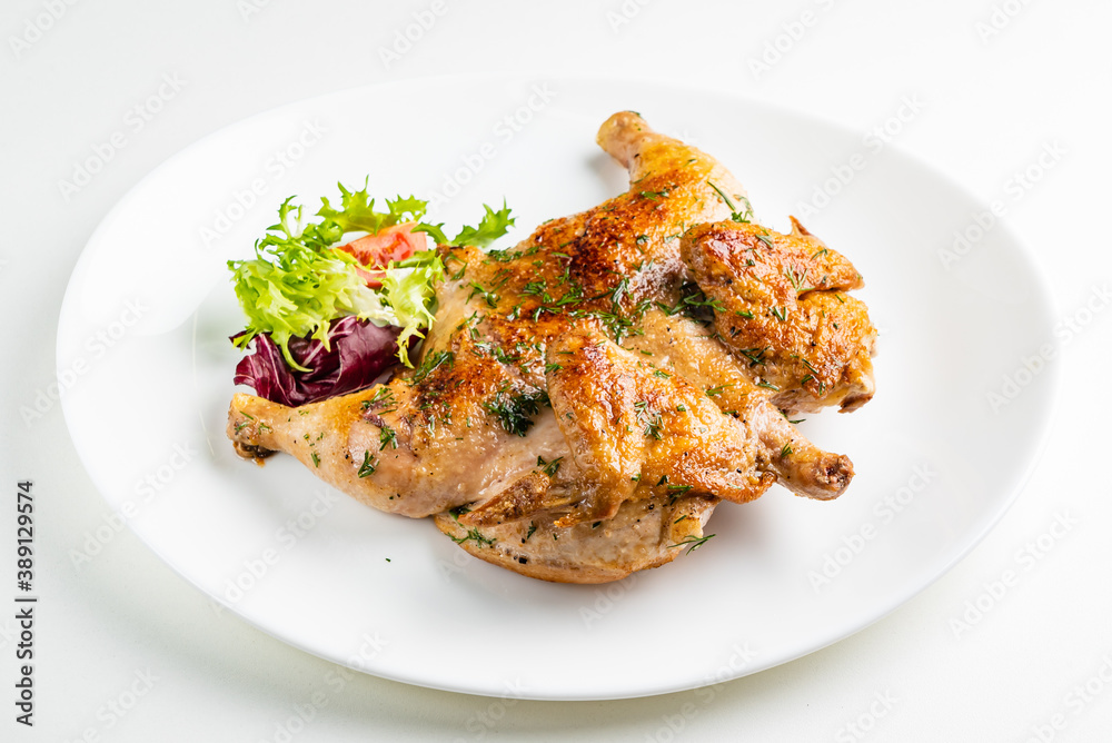 Grilled Chicken tobacco on the white plate Grilled Chicken tobacco on the white plate