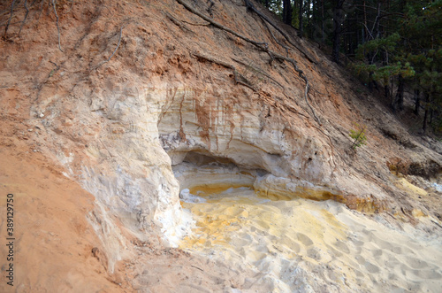 Layers of colored sand. Snow white quartz sand. Shore of Blue Lake in the Chernigow region, Ukraine.Former quarry of quartz sand for glass production.Popular local resort at present