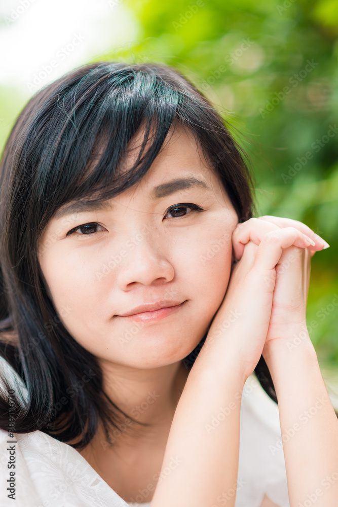 Fashion asian girl outdoor portrait walking in summer park and with long black hair Fashion asian girl outdoor portrait walking in summer park and with long black hair