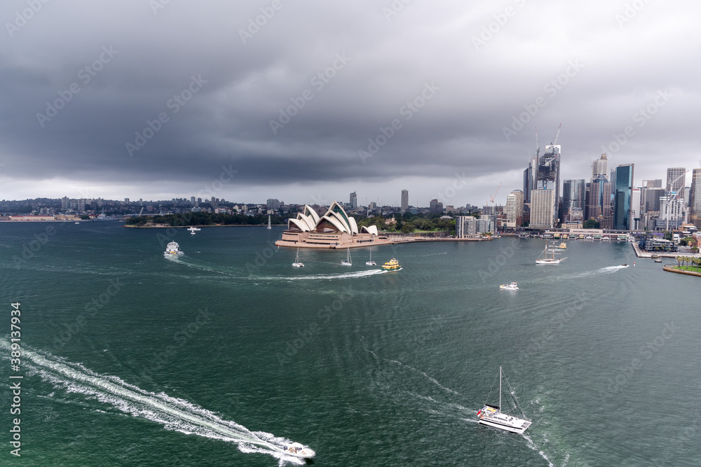 Naklejka premium Sydney harbour during a thunderstorm and dark moody sky