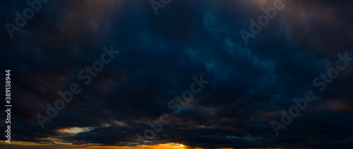 Slika na platnu Dark orange sky, sunset, panorama. Storm clouds.