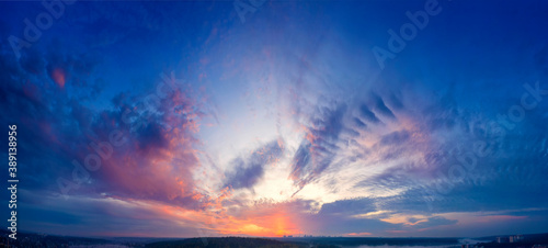 Dawn or sunset over the clouds, blue hour, aerial view.