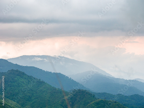 Beautiful nature of hills and mountains complex with morning mist atmosphere at Mae Wong National park, Kamphaeng Phet, Thailand.