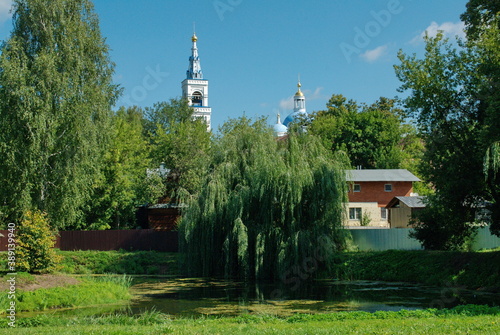 Dedenevo. Dmitrov district. Moscow region. Russia. August 09.2016. View of the bell tower of St. Saviour and Blachernitissa Convent on sunny days photo