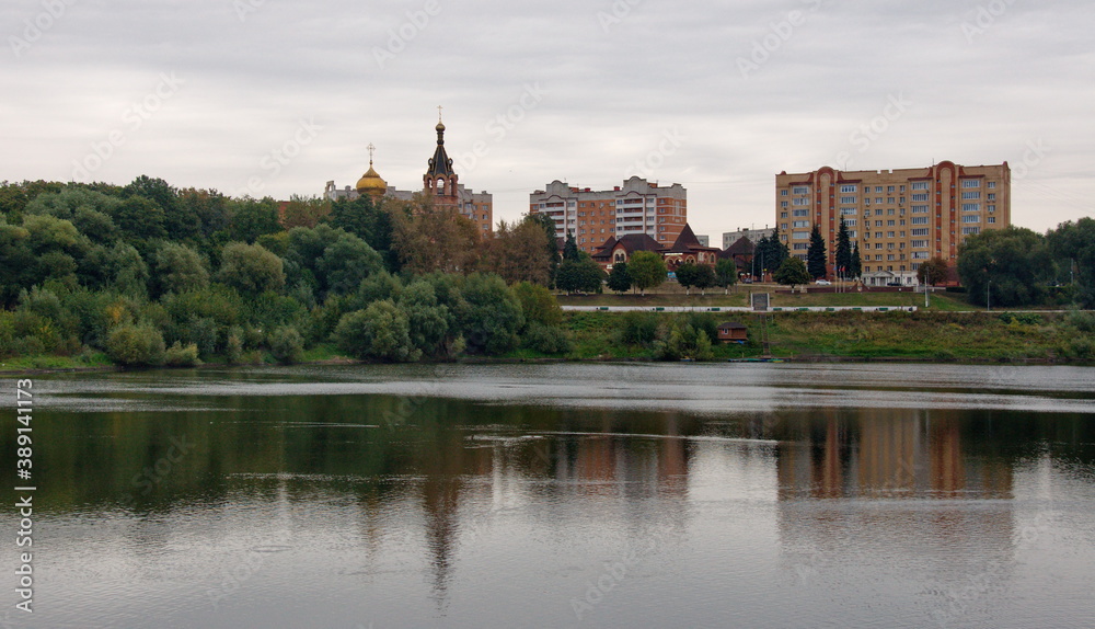 City Of Ramenskoye. Moscow region. Russia. September. 19. 2018. View of the borisoglebskoe lake and the Orthodox Church on a cloudy autumn morning.