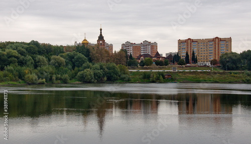 City Of Ramenskoye. Moscow region. Russia. September. 19. 2018. View of the borisoglebskoe lake and the Orthodox Church on a cloudy autumn morning. © Andrey