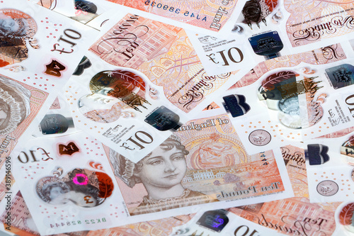 Foto Heap of ten pound banknotes - British Currency concept.