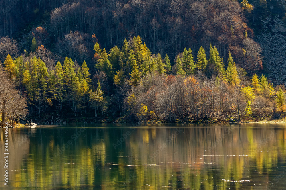 Reflections of autumn foliage in the still water of Lake Santo Modenese, Emilia Romagna, Italy Reflections of autumn foliage in the still water of Lake Santo Modenese, Emilia Romagna, Italy