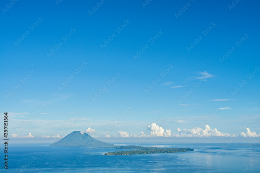 View of Manado Tua mountain and Bunaken Island from Tumpa Mountanin. Manado Tua Mountain and Bunaken Island is landmarks and popular tourist destination in Manado, Indonesia.
