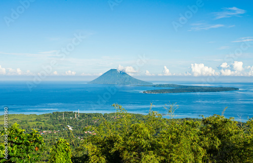 Fotografie View of Manado Tua mountain and Bunaken Island from Tumpa Mountanin
