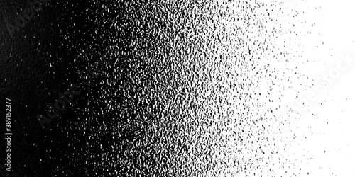 Black on white background. Black and white dissolve in half in each other. Silky rough textured black matter mixed with white. Looks like halftone of mix grunge. Art Illustration photo