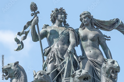 Old statue of Dionis and Aridna quadriga with four panthers on the top of the State Opera House in downtown of Dresden, Germany, details, closeup photo