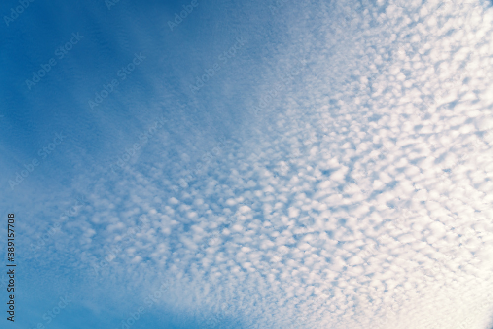 Fluffy white clouds flying on blue sky background Fluffy white clouds flying on blue sky background