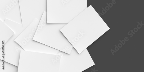 White writing paper scattered on a dark background. Place for your text. 