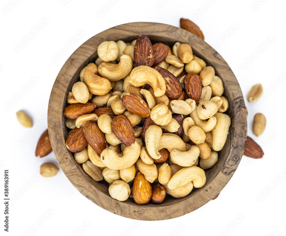Roasted nuts isolated on white (close up; selective focus) Roasted nuts isolated on white (close up; selective focus)