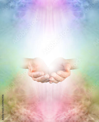 Ask Believe Receive in the healing Power of Loving Kindness - female  cupped hands emerging from multicoloured ethereal background with copy space above and below
