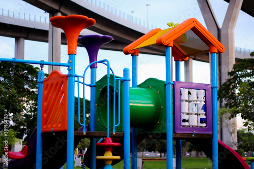 View playground in garden park colorful playground for children	