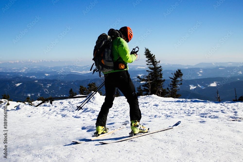 Ski mountaineer on the top of Lyse Hora in the Beskydy Mountains in Moravia  in the Czech Republic. Stock Photo | Adobe Stock