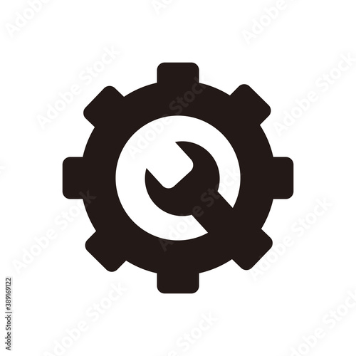 Mechanical gear icon with wrench in the middle for repair in white background .