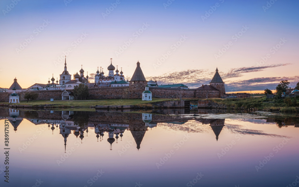A beautiful view of the Solovetsky Monastery with a mirror image in the water