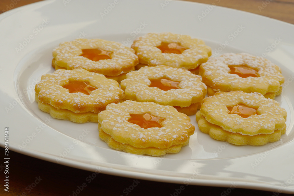 delicious linzer cookies on white plate delicious linzer cookies on white plate