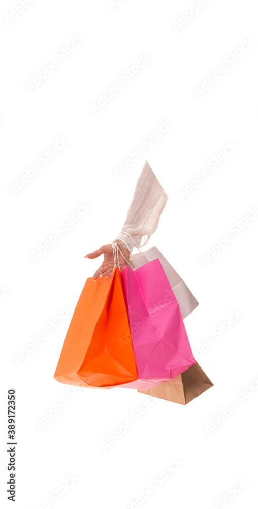 Girl hand with packages after sale. Hand holds a bunch of packages with new purchases. Girl hand with packages after sale. Hand holds a bunch of packages with new purchases.