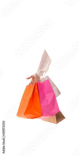 Girl hand with packages after sale. Hand holds a bunch of packages with new purchases. 