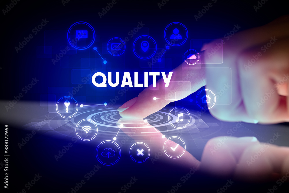 Obraz premium Finger touching tablet with web technology icons and QUALITY inscription, web technology concept