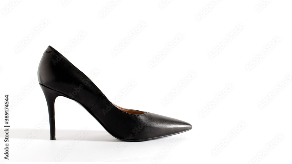 Classical black shoes. High heel shoes on white background. Side view picture. Space for text. Element for design. Classical black shoes. High heel shoes on white background. Side view picture. Space for text. Element for design.