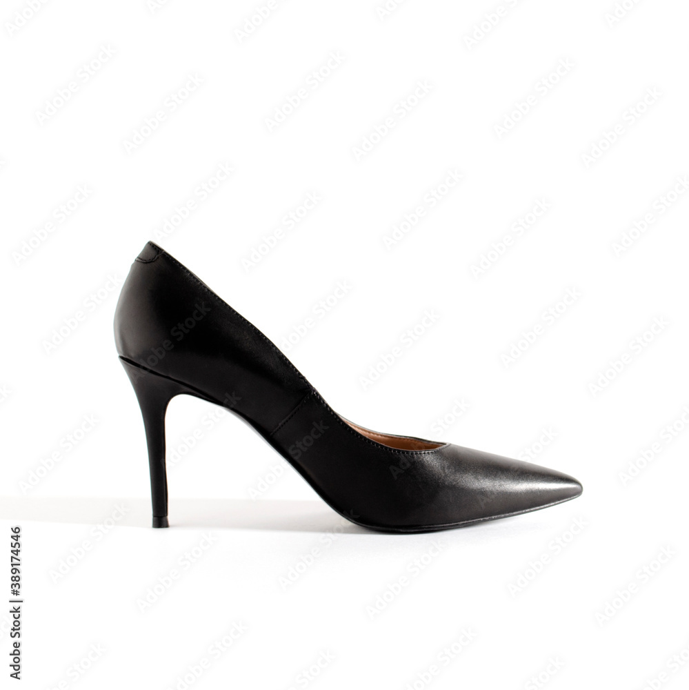 Classical black shoes. High heel shoes on white background. Side view picture. Space for text. Element for design. Classical black shoes. High heel shoes on white background. Side view picture. Space for text. Element for design.