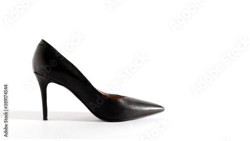 Classical black shoes. High heel shoes on white background. Side view picture. Space for text. Element for design.