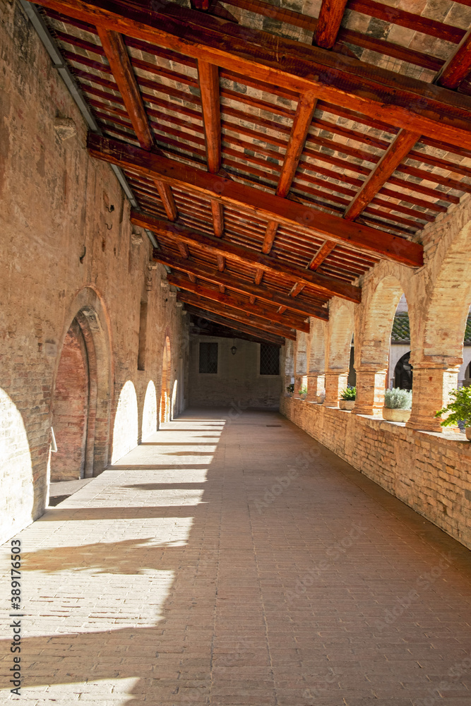 Panoramic view of the courtyard at the kiosk of the Abbadia di Fiastra, in Italy. Panoramic view of the courtyard at the kiosk of the Abbadia di Fiastra, in Italy.