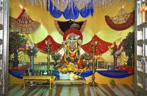 White stone sculpture of Hindu Goddess Ashapura Mata at a temple in Beawar. Ashapura is Clan Deity of King Prithviraj Chauhan. She is Goddess who fulfills wish & desires of all those who trust her.  photo