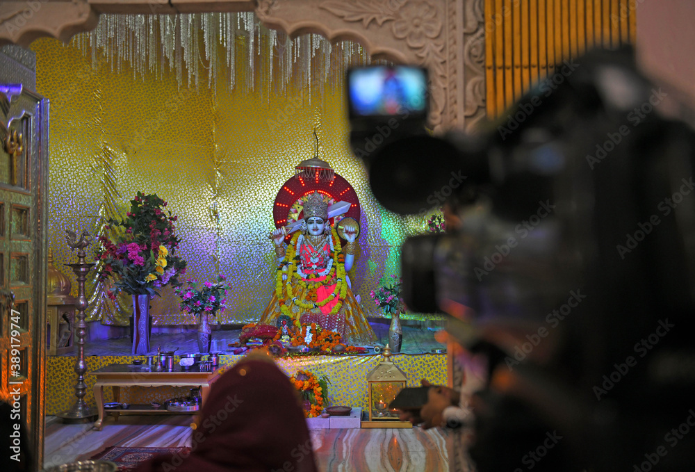 A video camera being used to record 'aarti' ritual of Goddess Durga ...