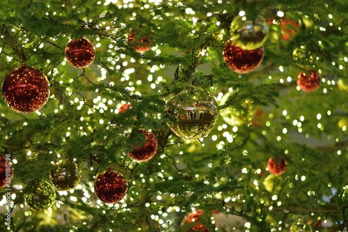 Background of Christmas tree decorations with illuminations