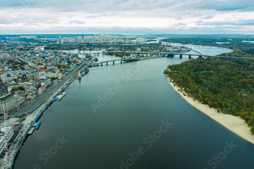 Aerial view of the Dnipro River and districts of Kyiv - the largest city and capital of Ukraine.