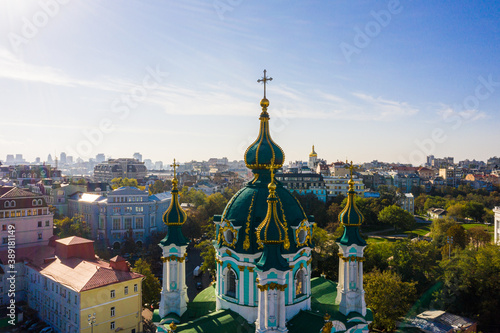 Aerial top view of Saint Andrew's church and Andreevska street from above, Podol district, city of Kyiv, Ukraine photo