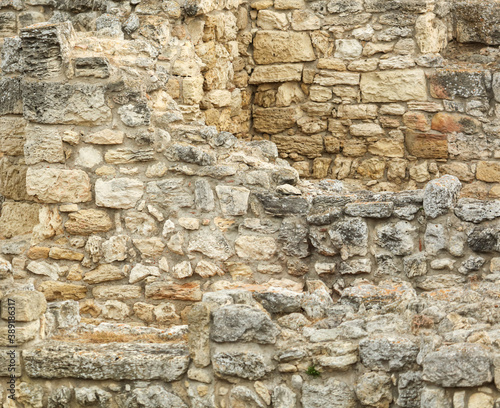 Stones in the wall of the house as an abstract background.