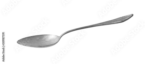 vintage metal spoon on white background